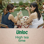 Lifestyle shot of two people at a small outdoor table sharing snacks with a Ziploc printable paper bag visible between them.