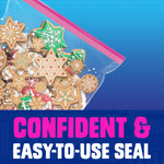 Photo-style image of a Ziploc slider bag filled with decorated gingerbread cookies highlighting the pink zipper seal.